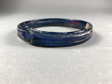 Roman. <em>Blue Bracelet</em>, 4th century C.E. Glass, 1/2 × 3/16 × 3 in. (1.3 × 0.4 × 7.6 cm). Brooklyn Museum, Gift of Robert B. Woodward, 01.98. Creative Commons-BY (Photo: , CUR.01.98_view03.jpg)