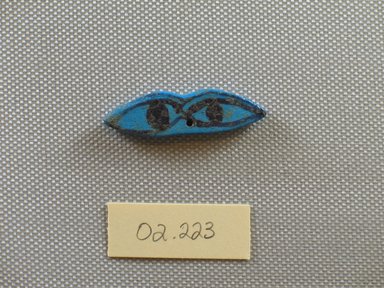  <em>Amulet in the Form of Two Eyes</em>, ca. 1539–1075 B.C.E. Faience, 1/2 x 3/16 x 1 9/16 in. (1.2 x 0.4 x 4 cm). Brooklyn Museum, Gift of the Egypt Exploration Fund, 02.223. Creative Commons-BY (Photo: Brooklyn Museum, CUR.02.223_view1.jpg)