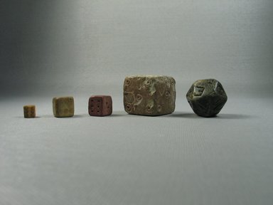  <em>Cubical Die</em>, 305 B.C.E.-395 C.E. Terracotta, 9/16 x 9/16 x 9/16 in. (1.3 x 1.3 x 1.3 cm). Brooklyn Museum, Gift of Evangeline Wilbour Blashfield, Theodora Wilbour, and Victor Wilbour honoring the wishes of their mother, Charlotte Beebe Wilbour, as a memorial to their father, Charles Edwin Wilbour, 16.593. Creative Commons-BY (Photo: , CUR.02.231_35.1912_16.593_16.741_37.453E_view01.jpg)