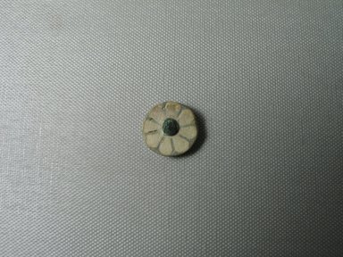  <em>Rosette Inlay</em>, ca. 1187-1156 B.C.E. Faience, 3/8 × Diam. 7/8 in. (0.9 × 2.2 cm). Brooklyn Museum, Gift of the Egypt Exploration Fund, 02.237. Creative Commons-BY (Photo: , CUR.02.237_view01.jpg)