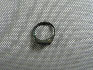  <em>Finger Ring</em>, 3rd-4th century C.E. Bronze, glass, 3/8 × 11/16 × 13/16 in. (0.9 × 1.8 × 2.1 cm). Brooklyn Museum, Gift of the Egypt Exploration Fund, 02.244. Creative Commons-BY (Photo: , CUR.02.244_view01.jpg)