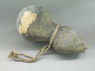 Ancient Pueblo (Anasazi). <em>Gourd-shaped Blackware Jar</em>, 500-700, Basketmaker III (probably). Clay, slip, rawhide, 13 3/4 x 1 1/8 in (34.0 x 2.9 cm). Brooklyn Museum, Riggs Pueblo Pottery Fund, 02.257.2397. Creative Commons-BY (Photo: Brooklyn Museum, CUR.02.257.2397.jpg)