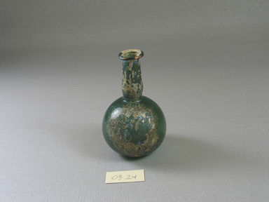 Roman. <em>Small Bottle of Plain Blown Emerald Green Glass</em>, 3rd-8th century C.E. (probably). Glass, 3 1/4 x greatest diam. 2 in. (8.3 x 5.1 cm). Brooklyn Museum, Gift of Robert B. Woodward, 03.24. Creative Commons-BY (Photo: Brooklyn Museum, CUR.03.24_view1.jpg)
