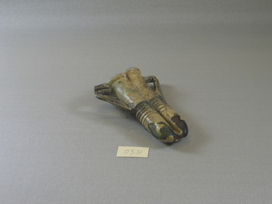 Roman. <em>Double Cosmetic Tube with Handles</em>, 4th-5th century C.E. Glass, 3 1/8 x 1 1/4 x 4 1/4 in. (7.9 x 3.2 x 10.8 cm). Brooklyn Museum, Gift of Robert B. Woodward, 03.31. Creative Commons-BY (Photo: Brooklyn Museum, CUR.03.31_view1.jpg)