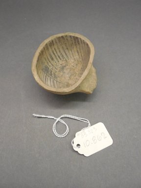 Ancient Pueblo. <em>Ladle Fragment</em>, Probably 1070-1300, Pueblo III. Clay, slip, pigment, 2 1/8 x 2 3/4 x 1 1/8 in. (5.4 x 7 x 2.9 cm). Brooklyn Museum, Museum Expedition 1903, Purchased with funds given by A. Augustus Healy and George Foster Peabody, 03.325.10862. Creative Commons-BY (Photo: Brooklyn Museum, CUR.03.325.10862.jpg)
