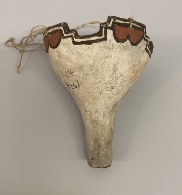 She-we-na (Zuni Pueblo). <em>Flute (Shu-lu-lu-nan-nai)</em>. Clay, pigment, string, 4 1/8 × 3 1/2 × 3 7/16 in. (10.5 × 8.9 × 8.7 cm). Brooklyn Museum, Museum Expedition 1903, Museum Collection Fund, 03.325.3261. Creative Commons-BY (Photo: Brooklyn Museum, CUR.03.325.3261_view01.jpg)
