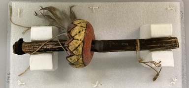 A:shiwi (Zuni Pueblo). <em>Dance Flute (Sho-ko-nun)</em>. Cane, gourd, string, pigment, cloth, feathers, 14 3/16 x 4 7/16in. (36 x 11.3cm). Brooklyn Museum, Museum Expedition 1903, Museum Collection Fund, 03.325.3265. Creative Commons-BY (Photo: Brooklyn Museum, CUR.03.325.3265_view01.jpg)