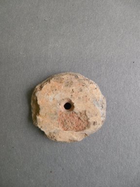 Ancient Pueblo (Anasazi). <em>Perforated Grey Disk</em>, Prehistoric. Clay, slip, diam: 1 1/8 in. (2.9 cm). Brooklyn Museum, Museum Expedition 1903, Museum Collection Fund, 03.325.4362. Creative Commons-BY (Photo: Brooklyn Museum, CUR.03.325.4362.jpg)