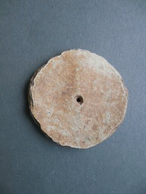 Ancient Pueblo. <em>Perforated Disk</em>, Prehistoric. Clay, slip, diam: 2 1/4 in. (5.8 cm). Brooklyn Museum, Museum Expedition 1903, Museum Collection Fund, 03.325.4363. Creative Commons-BY (Photo: Brooklyn Museum, CUR.03.325.4363.jpg)