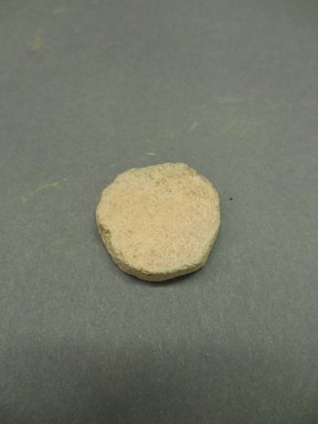 Ancestral Pueblo. <em>Flat, Round Disk</em>, Prehistoric. Clay, 1 1/8 x 3/8 in. (2.9 x 1 cm). Brooklyn Museum, Museum Expedition 1903, Museum Collection Fund, 03.325.4364. Creative Commons-BY (Photo: Brooklyn Museum, CUR.03.325.4364.jpg)