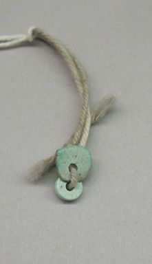 Southwest (unidentified). <em>2 Flat Blue Beads</em>. Turquoise, diam. largest: 1/4 in. Brooklyn Museum, Museum Expedition 1903, Museum Collection Fund, 03.325.4508a-b. Creative Commons-BY (Photo: , CUR.03.325.4508a-b.jpg)