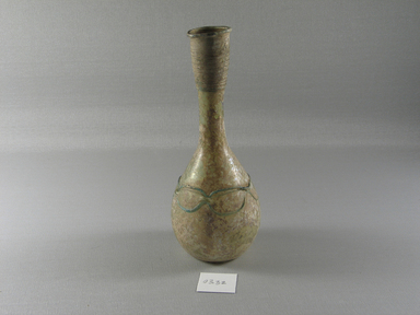 Roman. <em>Bottle of Blown Glass</em>, 4th-early 8th century C.E. Glass, 7 5/16 x Diam. 2 15/16 in. (18.5 x 7.4 cm). Brooklyn Museum, Gift of Robert B. Woodward, 03.32. Creative Commons-BY (Photo: Brooklyn Museum, CUR.03.32_view1.jpg)