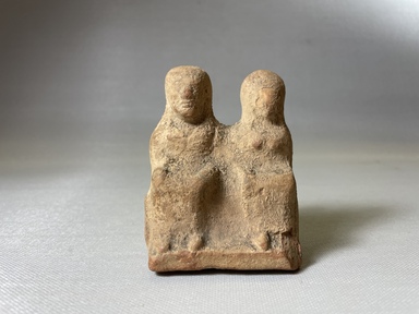 Possibly Greek. <em>Votive Statuette of Brick Red Terracotta</em>, 4th century B.C.E. Clay, slip, pigment, 3 1/4 × 2 3/8 × 1 3/4 in. (8.3 × 6 × 4.5 cm). Brooklyn Museum, Purchase gift of Robert B. Woodward and Carll H. de Silver, 04.18. Creative Commons-BY (Photo: Brooklyn Museum, CUR.04.18_view01.jpg)
