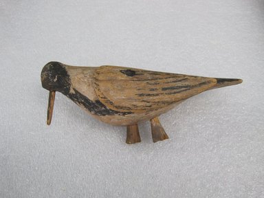 She-we-na (Zuni Pueblo). <em>Wild Pigeon, (hi-lo-bie) used by the Great Fire Society</em>, purchased in 1904. Wood, paint, 3 1/2 × 2 × 7 1/2 in. (8.9 × 5.1 × 19.1 cm). Brooklyn Museum, Museum Expedition 1904, Museum Collection Fund, 04.297.5107. Creative Commons-BY (Photo: , CUR.04.297.5107_view01.jpg)
