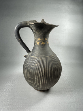Italiote. <em>Oinochoe</em>, late 4th-3rd century B.C.E. Clay, slip, 9 15/16 x greatest diam. 5 7/8 in. (25.2 x 14.9 cm). Brooklyn Museum, Purchase gift of Robert B. Woodward and Carll H. de Silver, 04.9. Creative Commons-BY (Photo: Brooklyn Museum, CUR.04.9_view01.jpg)