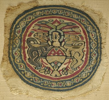 Coptic. <em>Roundel with Figure in Chariot Drawn by Two Bulls</em>, late 6th century-early 7th century C.E. Flax, wool, 5 1/8 x 5 1/2 in. (13 x 14 cm). Brooklyn Museum, Charles Edwin Wilbour Fund, 05.305. Creative Commons-BY (Photo: Brooklyn Museum (in collaboration with Index of Christian Art, Princeton University), CUR.05.305_ICA.jpg)