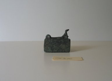  <em>Amulet in the Form of an Oblong Receptacle</em>. Bronze, 1 3/8 x 1 1/4 x 1 9/16 in. (3.6 x 3.2 x 4 cm). Brooklyn Museum, Charles Edwin Wilbour Fund, 05.375. Creative Commons-BY (Photo: Brooklyn Museum, CUR.05.375_view3.jpg)
