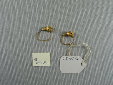 Greek. <em>Pair of Earrings</em>, late 4th–3rd century B.C.E. Gold, 13/16 x Diam. 3/4 in. (2 x 2 cm). Brooklyn Museum, Ella C. Woodward Memorial Fund, 05.454.1-.2. Creative Commons-BY (Photo: Brooklyn Museum, CUR.05.454.1-.2_view1.jpg)