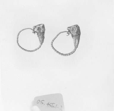 Greek. <em>Pair of Earrings</em>, late 4th century B.C.E.-3rd century B.C.E. Gold, glass, 7/8 x Diam. 11/16 in. (2.3 x 1.7 cm). Brooklyn Museum, Ella C. Woodward Memorial Fund, 05.455.1-.2. Creative Commons-BY (Photo: Brooklyn Museum, CUR.05.455.1-.2_NegB_print_bw.jpg)
