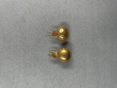 Roman. <em>Pair of Earrings of Hook Type</em>, 1st-2nd century C.E. Gold, 05.461.1: 11/16 × Diam. 1 1/16 in. (1.8 × 2.7 cm). Brooklyn Museum, Ella C. Woodward Memorial Fund, 05.461.1-.2. Creative Commons-BY (Photo: Brooklyn Museum, CUR.05.461.1-.2_overall.JPG)