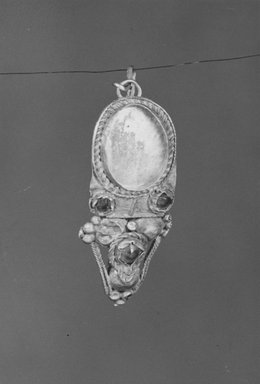 Roman. <em>Earring</em>, 3rd century C.E. Gold, garnet, 1 13/16 in. (4.6 cm). Brooklyn Museum, Ella C. Woodward Memorial Fund, 05.470. Creative Commons-BY (Photo: Brooklyn Museum, CUR.05.470_NegA_print_bw.jpg)