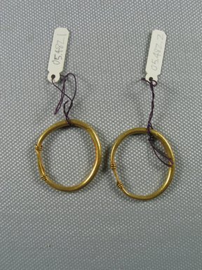 Roman. <em>Earrings</em>, 2nd-3rd century C.E. Gold, Diam: 1 1/8 in. (2.9 cm). Brooklyn Museum, Ella C. Woodward Memorial Fund, 05.482.1-.2. Creative Commons-BY (Photo: Brooklyn Museum, CUR.05.482.1-.2_overall.jpg)