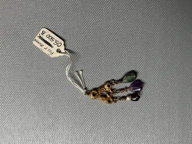  <em>Earring</em>, 6th century C.E. Gold, glass, amethyst, garnet, Total length: 3 in. (7.6 cm). Brooklyn Museum, Ella C. Woodward Memorial Fund, 05.500. Creative Commons-BY (Photo: Brooklyn Museum, CUR.05.500b.JPG)