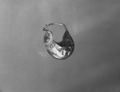 Roman. <em>Single Earring</em>, 3rd-4th century C.E. Gold, glass, 05.501a: Length: 13/16 in. (2 cm). Brooklyn Museum, Ella C. Woodward Memorial Fund, 05.501. Creative Commons-BY (Photo: Brooklyn Museum, CUR.05.501_NegA_print_bw.jpg)
