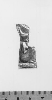  <em>Sheet Amulet with Relief Representations of Goddess Neith Squatting on Hieroglyph of Her Name</em>. Gold, 1 7/16 x 5/8 x 1/16 in. (3.7 x 1.6 x 0.1 cm). Brooklyn Museum, Charles Edwin Wilbour Fund, 05.576.6. Creative Commons-BY (Photo: Brooklyn Museum, CUR.05.576.6_print_NegA_bw.jpg)