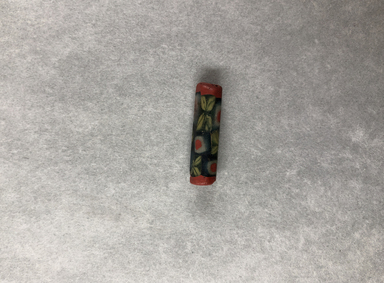  <em>Bead in Form of Heptagonal Cylinder</em>. Glass, 5/16 x 1 1/16 in. (0.8 x 2.8 cm). Brooklyn Museum, Charles Edwin Wilbour Fund, 05.579. Creative Commons-BY (Photo: , CUR.05.579_view01.jpg)