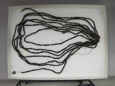 Hupa. <em>String of Beads</em>. Pine nuts, string, cotton cloth, 1 9/16 x 3 15/16 x 35 7/16 in.  (4.0 x 10.0 x 90.0 cm). Brooklyn Museum, Museum Expedition 1905, Museum Collection Fund, 05.588.7476. Creative Commons-BY (Photo: Brooklyn Museum, CUR.05.588.7476.jpg)
