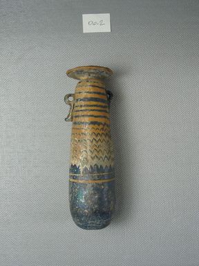  <em>Cylindrical Alabastron</em>, 5th century B.C.E. Glass, 1 5/16 x 1 5/16 x 4 9/16 in. (3.4 x 3.4 x 11.6 cm). Brooklyn Museum, Gift of Robert B. Woodward, 06.2. Creative Commons-BY (Photo: Brooklyn Museum, CUR.06.2_side2.jpg)