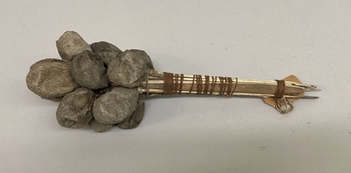 Pomo. <em>Doctor's Rattle</em>, late 19th - early 20th century. Attacus cocoons, gravel, wood, fiber, 11 3/4 × 4 × 3 1/2 in. (29.8 × 10.2 × 8.9 cm). Brooklyn Museum, Museum Expedition 1906, Museum Collection Fund, 06.331.7944. Creative Commons-BY (Photo: Brooklyn Museum, CUR.06.331.7944.jpg)