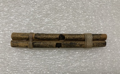 Pomo. <em>Double Dance Whistle</em>. Bone, cotton? thread, plant resin?, 11/16 × 5/16 × 4 5/16 in. (1.7 × 0.8 × 11 cm). Brooklyn Museum, Museum Expedition 1906, Museum Collection Fund, 06.331.7999. Creative Commons-BY (Photo: Brooklyn Museum, CUR.06.331.7999_view01.jpg)