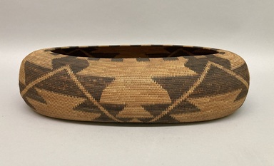 Pomo. <em>Coiled Boat-shaped Basket</em>, early 20th century. Willow, sedge root, bulrush root, redbud, 4 1/4 x 17 1/2 x 10 1/4 in. or (45.0 x 26.5 cm). Brooklyn Museum, Museum Expedition 1906, Museum Collection Fund, 06.331.8016. Creative Commons-BY (Photo: Brooklyn Museum, CUR.06.331.8016_view01.jpg)