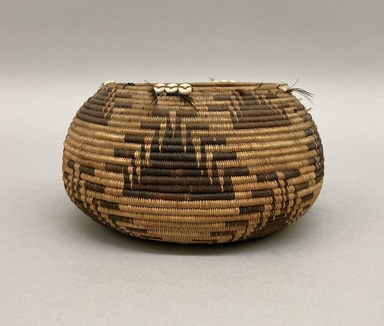 Pomo. <em>Basket</em>. Fiber, feather, shell, 3 × 5 1/4 × 5 1/4 in. (7.6 × 13.3 × 13.3 cm). Brooklyn Museum, Museum Expedition 1906, Museum Collection Fund, 06.331.8105. Creative Commons-BY (Photo: Brooklyn Museum, CUR.06.331.8105.jpg)