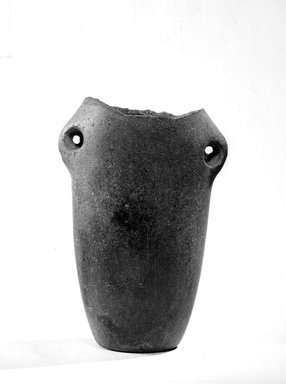  <em>Tubular Hanging Vase</em>, ca. 3500-3300 B.C.E. Basalt or arkose, 5 1/16 x 3 3/8 in. (12.8 x 8.5 cm). Brooklyn Museum, Charles Edwin Wilbour Fund, 07.447.189. Creative Commons-BY (Photo: Brooklyn Museum, CUR.07.447.189_NegA_print_bw.jpg)