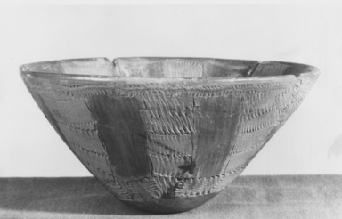 Nubian. <em>Bowl with Alternate Impressed and Red-polished Panels</em>, ca. 3500-3300 B.C.E. Clay, 3 1/2 x 7 9/16 in. (8.9 x 19.2 cm). Brooklyn Museum, Charles Edwin Wilbour Fund, 07.447.404. Creative Commons-BY (Photo: Brooklyn Museum, CUR.07.447.404_NegA_print_bw.jpg)