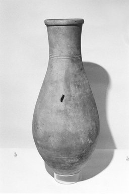  <em>Storage Vessel with Simple Incised Decoration</em>, ca. 1539-1425 B.C.E. Clay, 19 15/16 x Diam. 8 9/16 in. (50.6 x 21.7 cm). Brooklyn Museum, Charles Edwin Wilbour Fund, 07.447.444. Creative Commons-BY (Photo: Brooklyn Museum, CUR.07.447.444_NegL1012_19_print_bw.jpg)
