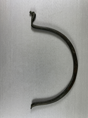  <em>Large thin handle, semi-circular</em>. Bronze, 9 11/16 × 5 × 1/4 in. (24.6 × 12.7 × 0.7 cm). Brooklyn Museum, Charles Edwin Wilbour Fund, 07.447.705. Creative Commons-BY (Photo: Brooklyn Museum, CUR.07.447.705_view01.jpg)