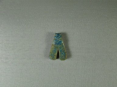  <em>Fly-Shaped Pendant Amulet</em>, ca. 1539-1292 B.C.E. Faience, 13/16 x 1/4 x 1 3/16 in. (2 x 0.7 x 3 cm). Brooklyn Museum, Charles Edwin Wilbour Fund, 07.447.738. Creative Commons-BY (Photo: Brooklyn Museum, CUR.07.447.738_view1.jpg)