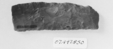  <em>Square-Ended Sickle Blade</em>, ca. 4400-2675 B.C.E. Flint, 1 1/8 x 3 5/16 in. (2.8 x 8.4 cm). Brooklyn Museum, Charles Edwin Wilbour Fund, 07.447.850. Creative Commons-BY (Photo: , CUR.07.447.850_NegID_07.447.810GRPA_print_cropped_bw.jpg)