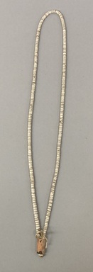 Pomo. <em>Necklace</em>, late 19th- early 20th century. Clam shell beads, cotton cord, magnesite, 14 1/4 × 2 1/2 × 7/16 in. (36.2 × 6.4 × 1 cm). Brooklyn Museum, Brooklyn Museum Collection, 07.452. Creative Commons-BY (Photo: Brooklyn Museum, CUR.07.452.jpg)