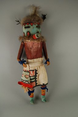 A:shiwi (Zuni Pueblo). <em>Kachina Doll (Otoh Tasha)</em>, late 19th century. Wood, cotton, fur, feather, wool, leather, 16 1/2 x 6 x 4 3/4 in. (41.9 x 15.2 x 12.1 cm). Brooklyn Museum, Museum Expedition 1907, Museum Collection Fund, 07.467.8445. Creative Commons-BY (Photo: Brooklyn Museum, CUR.07.467.8445_front.jpg)