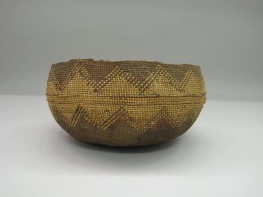 Hupa. <em>Basket</em>. Fiber, 4 7/8 × 9 × 9 1/8 in. (12.4 × 22.9 × 23.2 cm). Brooklyn Museum, By exchange, 07.468.9329. Creative Commons-BY (Photo: Brooklyn Museum, CUR.07.468.9329_side+1.jpg)