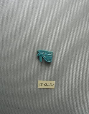  <em>Wadjet-eye Amulet</em>. Faience, 1/2 x 3/16 x 11/16 in. (1.3 x 0.5 x 1.8 cm). Brooklyn Museum, Charles Edwin Wilbour Fund, 08.480.160. Creative Commons-BY (Photo: Brooklyn Museum, CUR.08.480.160_view2.jpg)