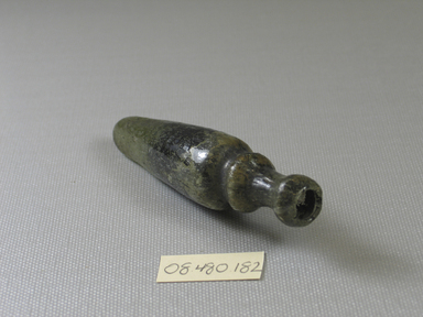 Islamic. <em>Flask</em>, 4th-5th century C.E., or 12th-13th century C.E. Glass, 3 9/16 x greatest width 7/8 in. (9.1 x 2.3 cm). Brooklyn Museum, Charles Edwin Wilbour Fund, 08.480.182. Creative Commons-BY (Photo: Brooklyn Museum, CUR.08.480.182_view1.jpg)