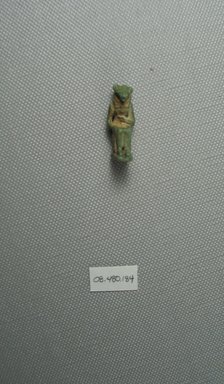  <em>Figure of a Seated Goddess</em>. Faience, 1 1/8 x 7/16 in. (2.9 x 1.1 cm). Brooklyn Museum, Charles Edwin Wilbour Fund, 08.480.184. Creative Commons-BY (Photo: Brooklyn Museum, CUR.08.480.184_View1.jpg)