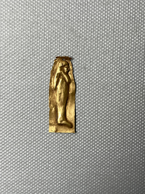  <em>Amulet in Form of Mummiform Figure</em>, 664-30 B.C.E. Gold, 1 5/16 x 1/2 x 1/16 in. (3.4 x 1.2 x 0.2 cm). Brooklyn Museum, Charles Edwin Wilbour Fund, 08.480.215. Creative Commons-BY (Photo: Brooklyn Museum, CUR.08.480.215_overall.JPG)