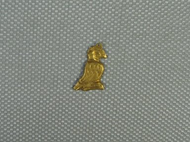  <em>Horus Falcon Amulet</em>, 664-30 B.C.E. Gold, 9/16 x 3/8 x 1/16 in. (1.5 x 1 x 0.1 cm). Brooklyn Museum, Charles Edwin Wilbour Fund, 08.480.218. Creative Commons-BY (Photo: Brooklyn Museum, CUR.08.480.218_view1.jpg)